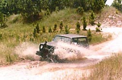 The Scout going through a mud hole.